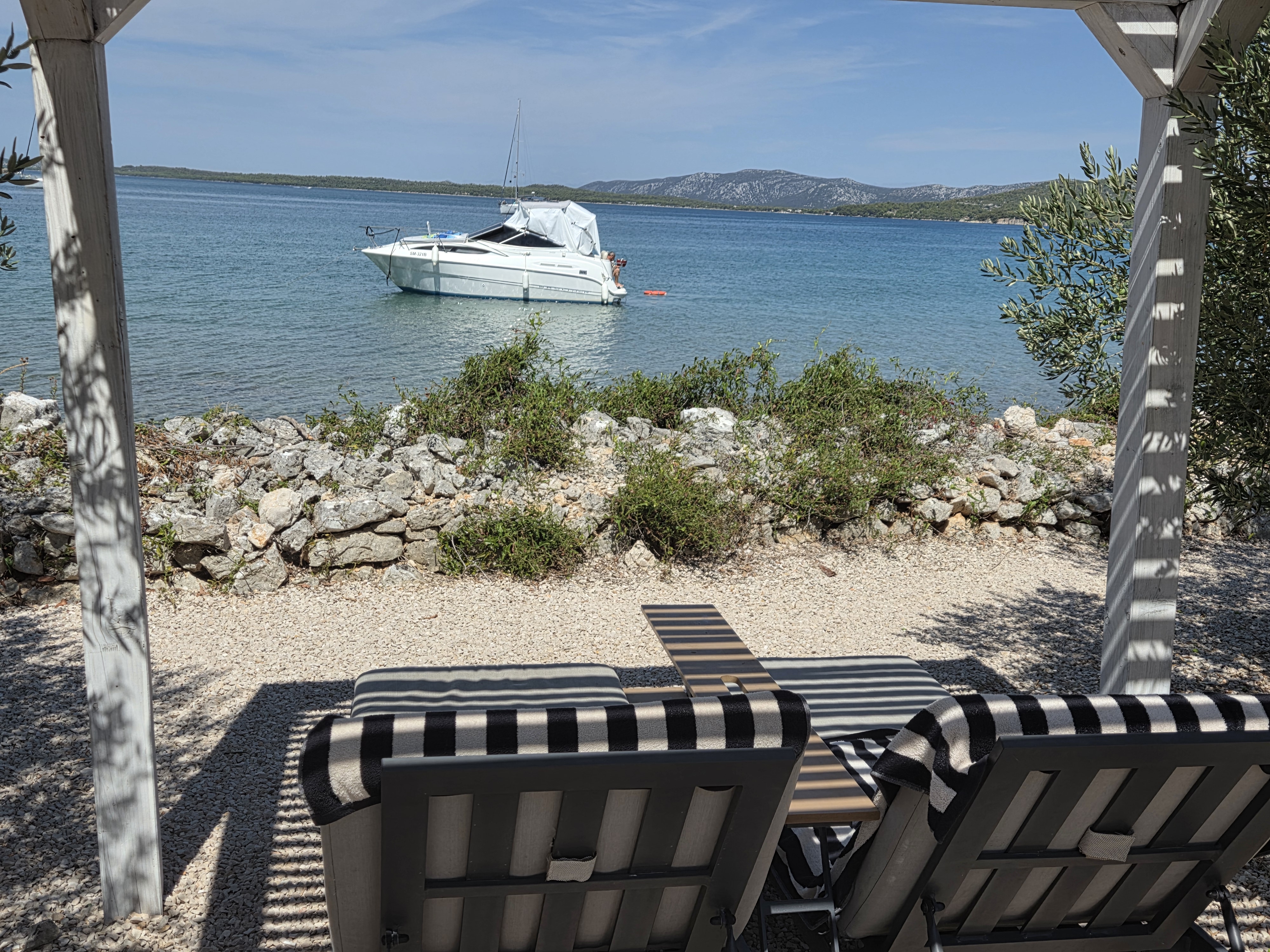 Beach lounge chairs and sea view